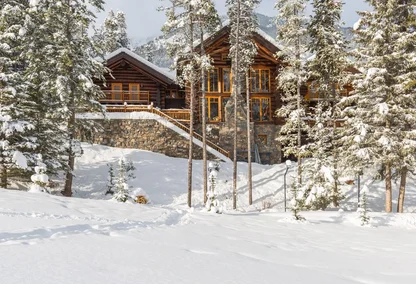 Luxury log cabin in snowy forest