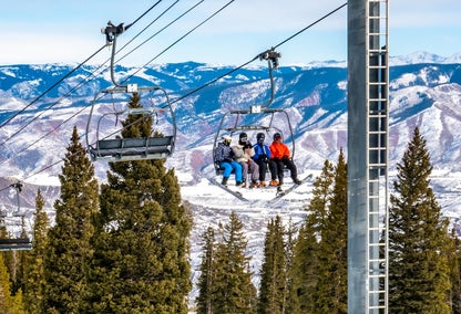 Skiers on chair life at Snowmass Village