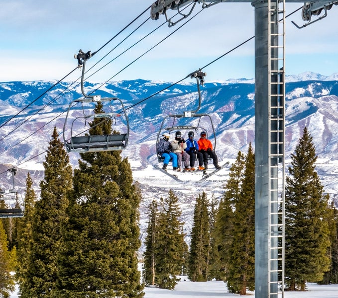 Skiers on chair life at Snowmass Village