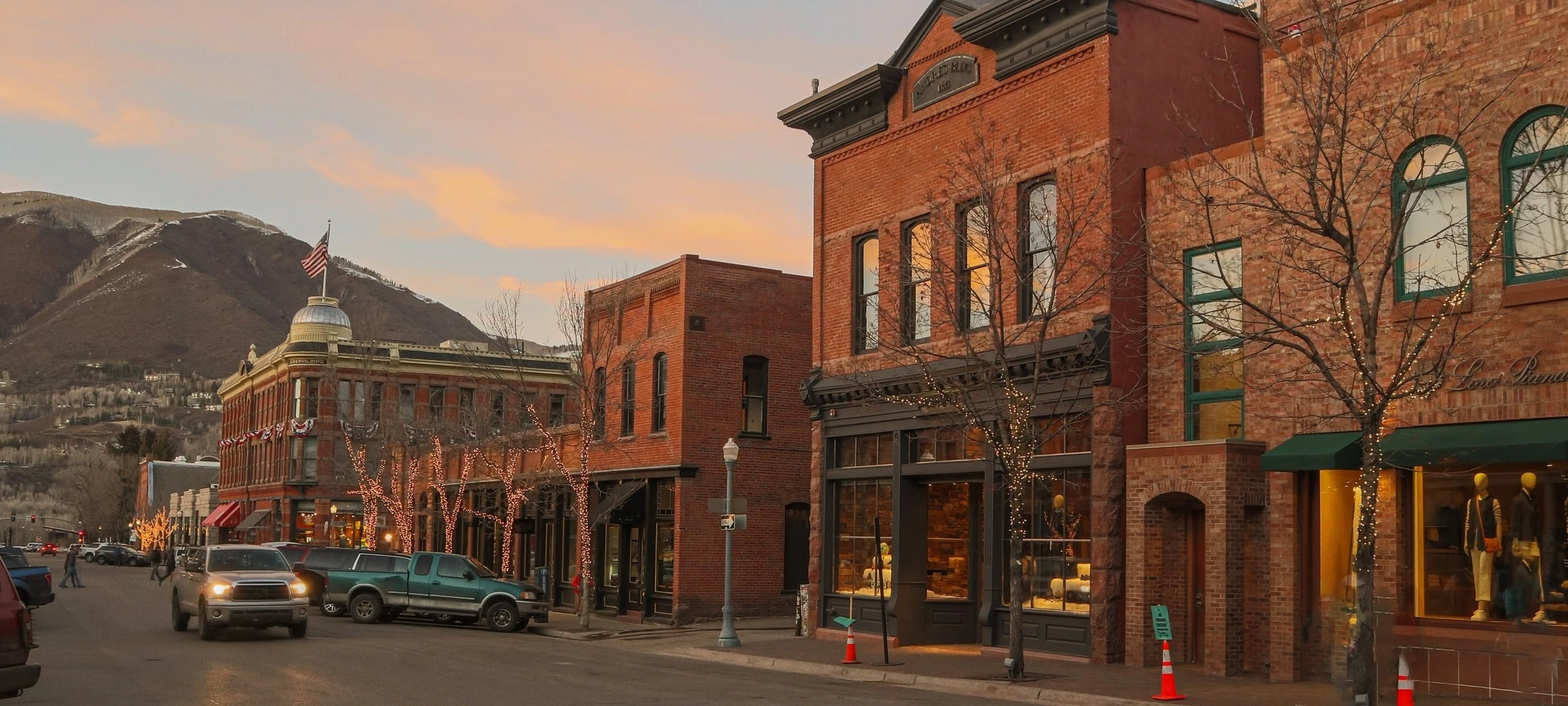 Street view of Central Core, Aspen shops and businesses during sunset