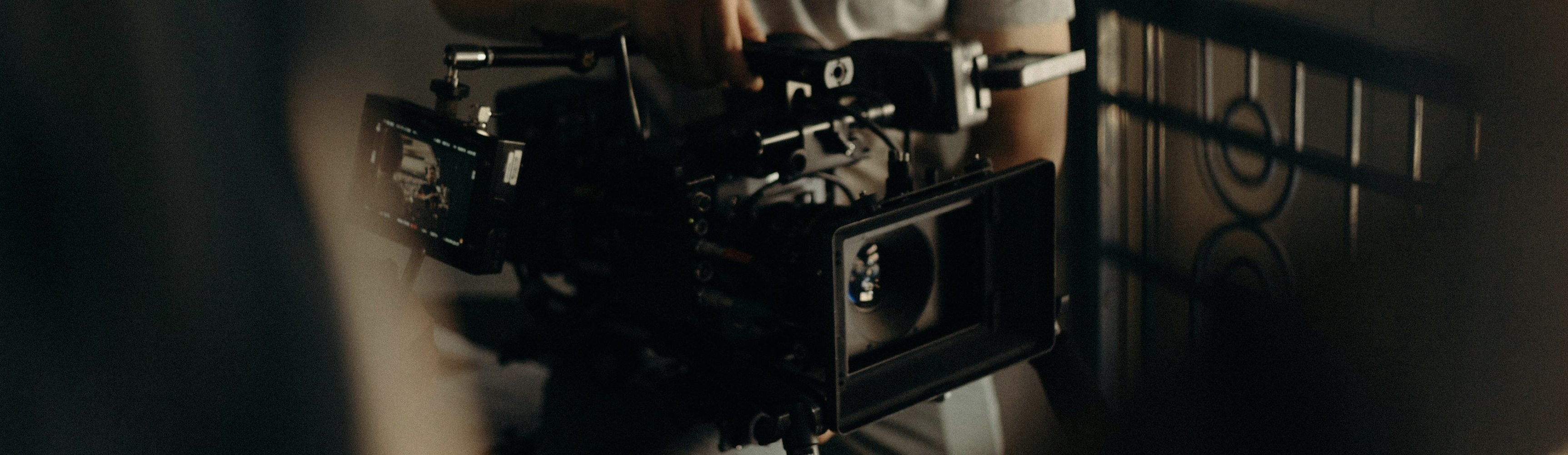 Person holding a movie film camera